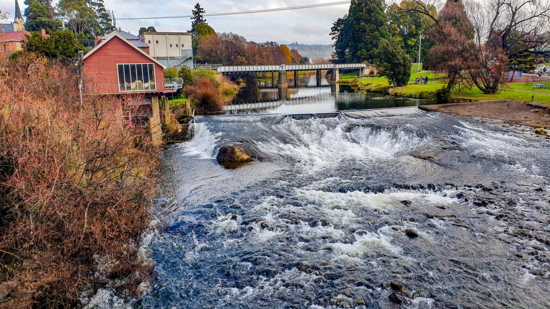 The weir along meander river in Deloraine